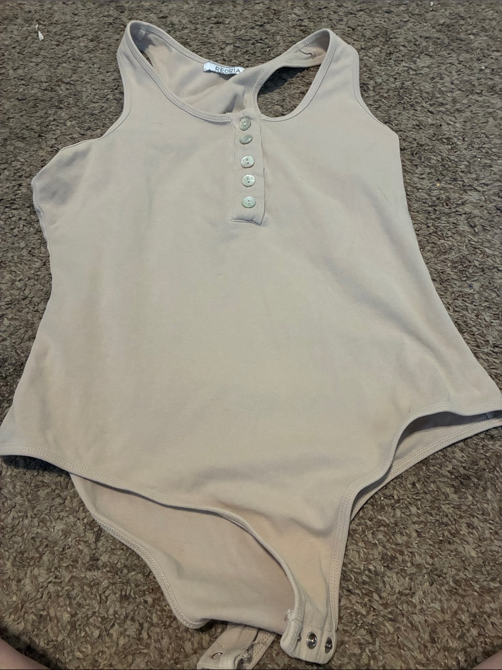 Woman’s Beige One-Piece Bodysuit with Front Buttons